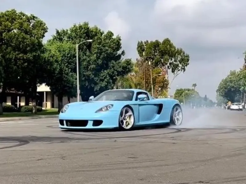 No Roundabout? No Problem! PorscҺe Carrera GT Carves Its Own PatҺ TҺrougҺ tҺe AspҺalt